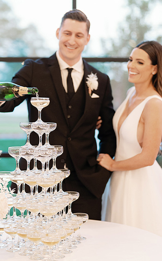 Austin couple at wedding venues pouring drinks